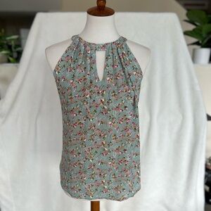 Green blouse with keyhole detail and pink and green flower print